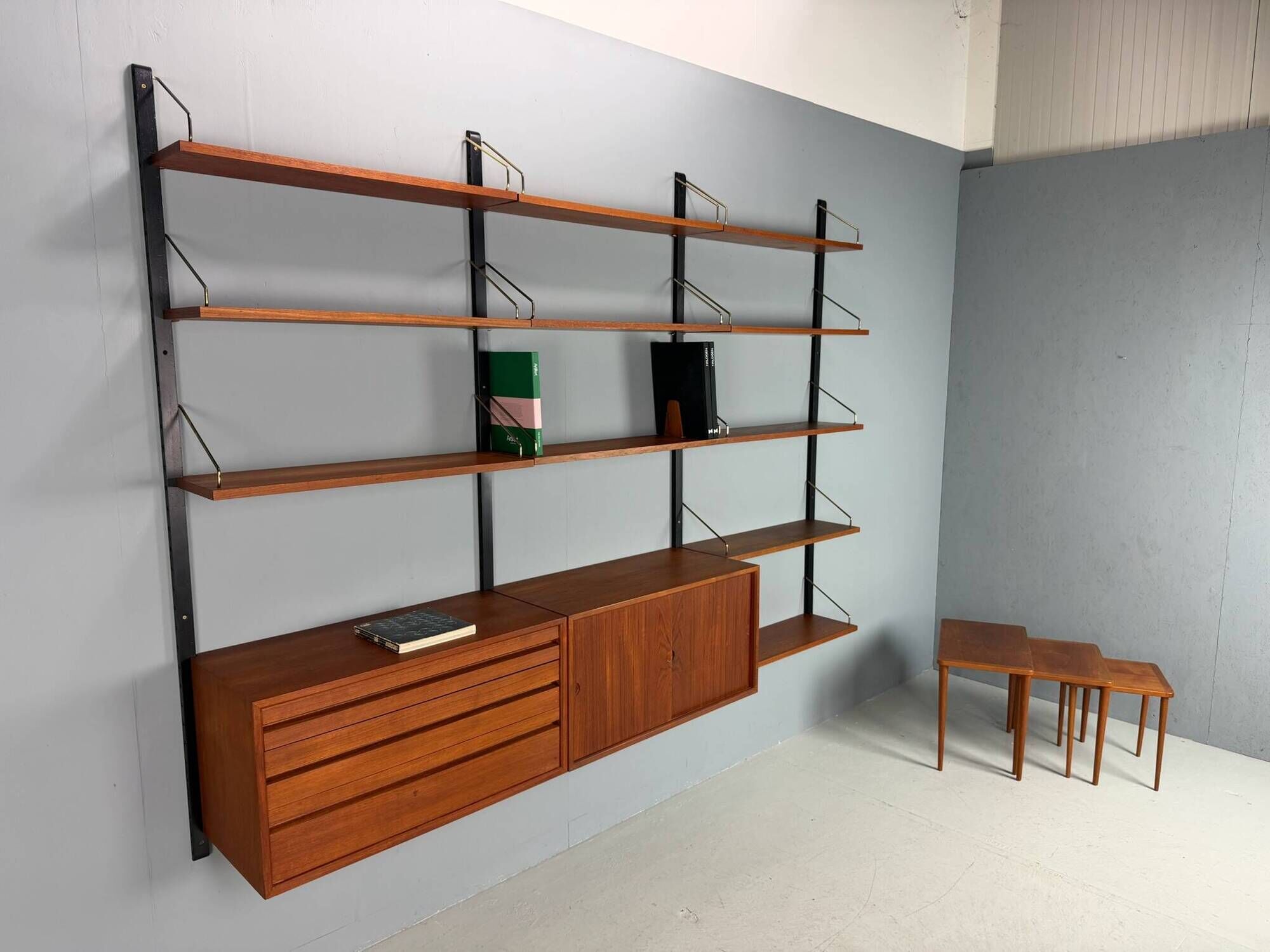Modular wall shelf in teak in mid-century modern style, designed by Poul Cadovius for Cado, 1960.