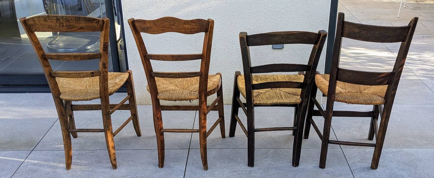 4 mismatched wood and straw chairs