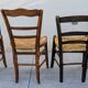 4 mismatched wood and straw chairs
