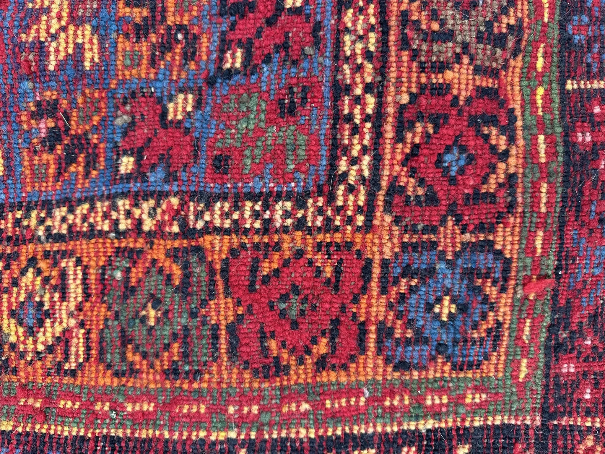 Old Moroccan carpet, made of natural wool and handwoven.