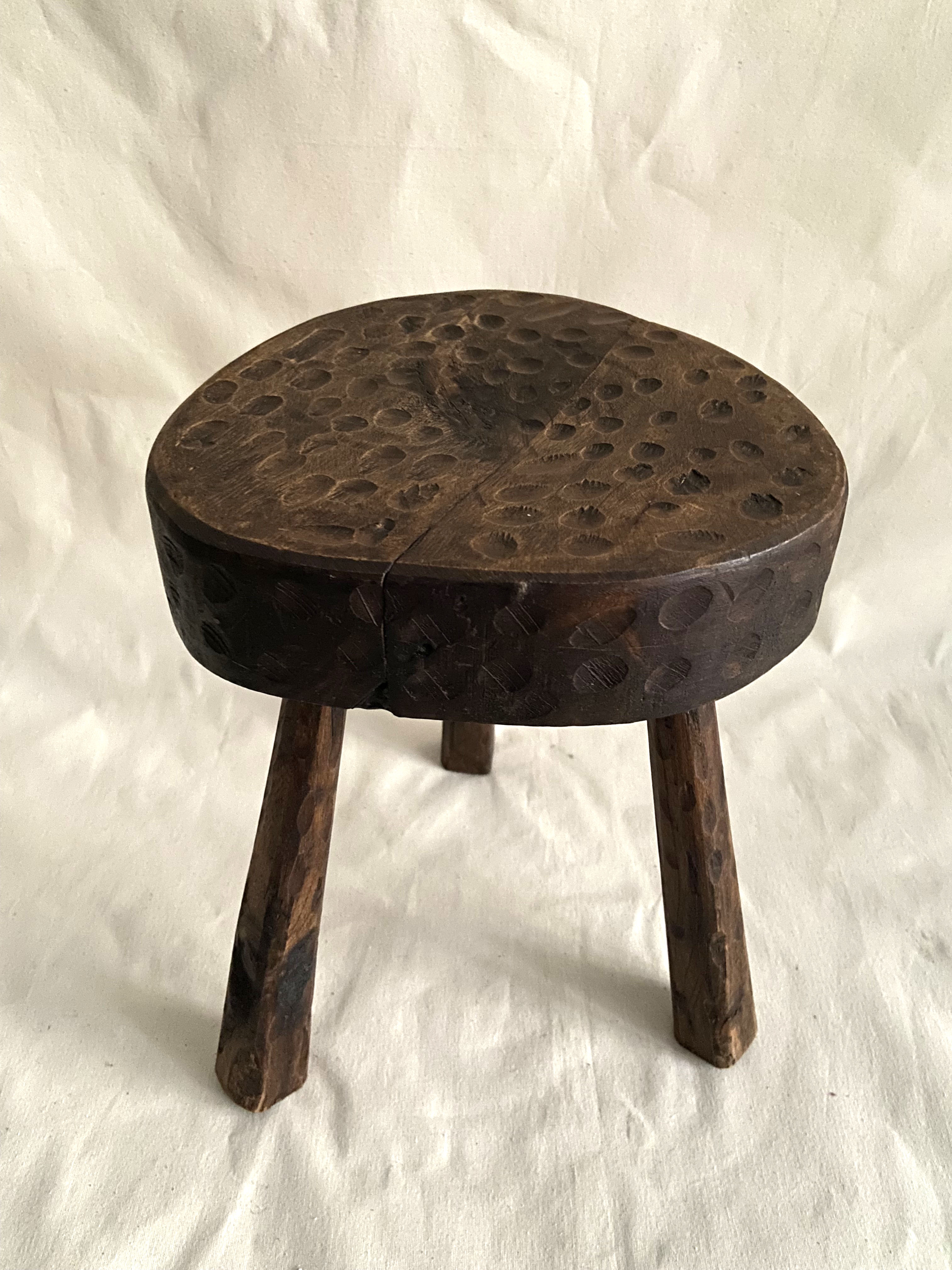 Brutalist tipode stool in carved wood