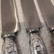 12 silver-plated Empire style table knives 25.3cm