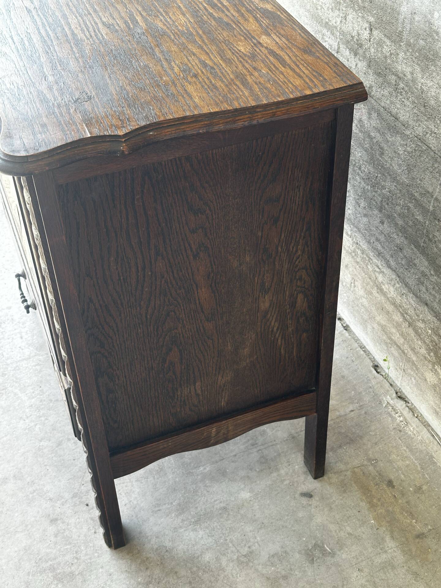 Small storage cabinet in carved oak – circa 1930