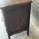 Small storage cabinet in carved oak – circa 1930