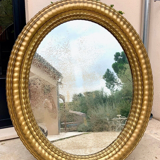 Oval mirror louis XVl with gilded cartouch, napoleon lll, XlXth high 106 cm