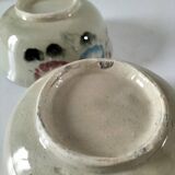 Two large vintage bowls in pastel decor on mini pedestals.