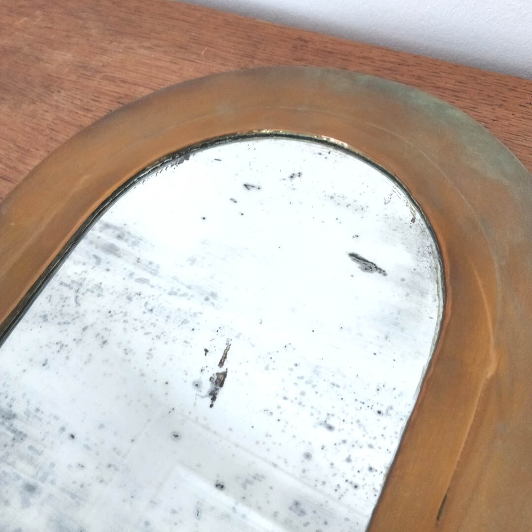 Half-moon brass mirror stitched ice