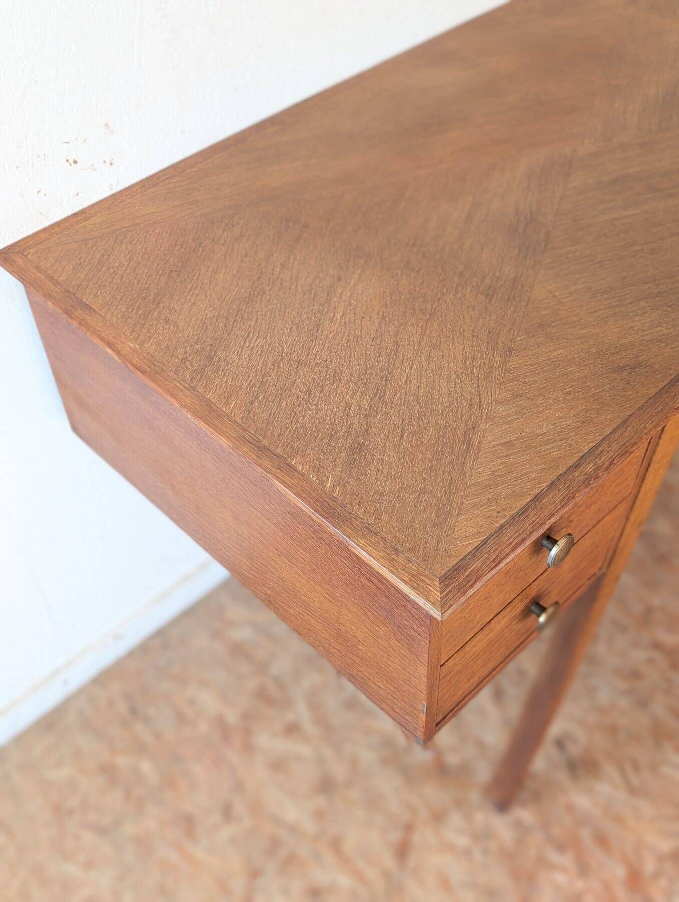 1950s oak double-sided desk with compass legs.