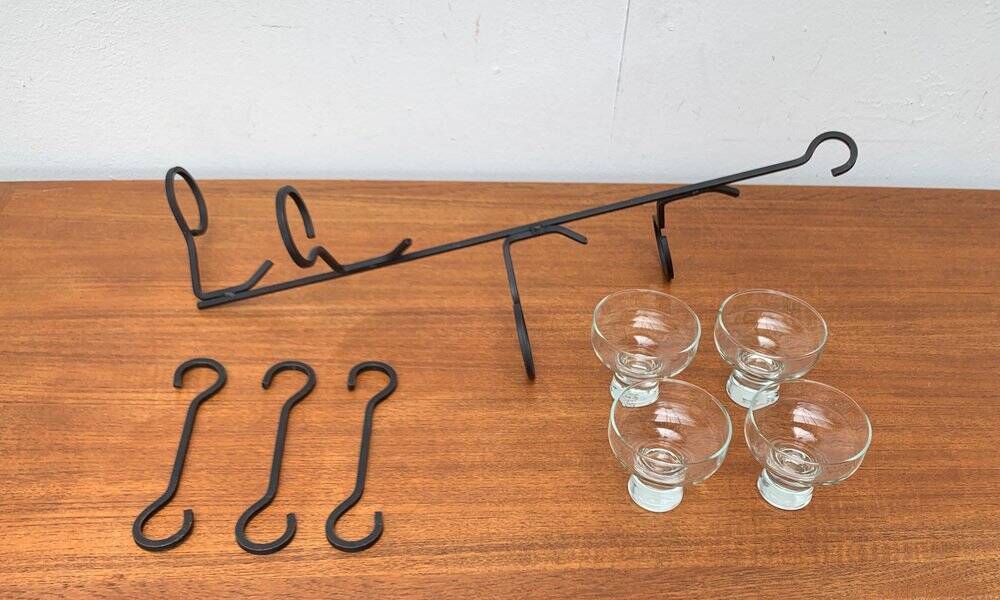 Mid-century metal and glass pendant light from the 1960s.