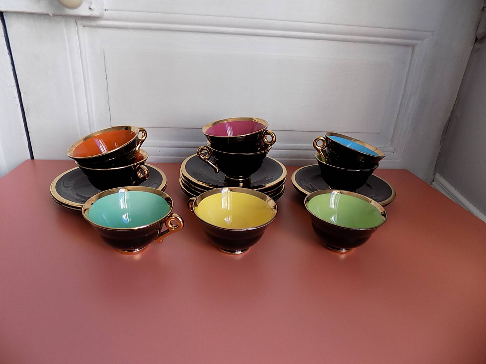 set of 9 black and gold Salins cups and saucers
