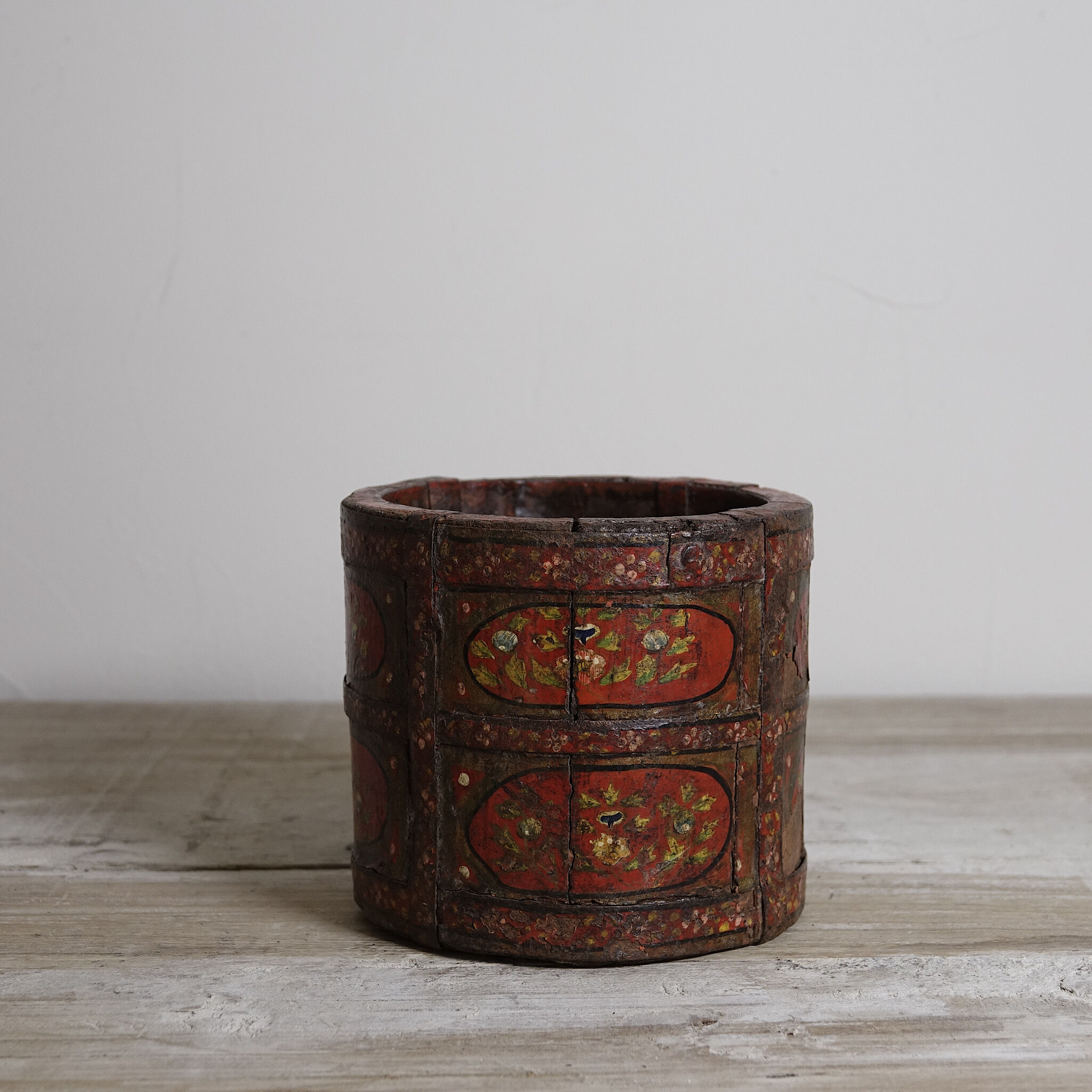 Antique wooden pot painted by hand