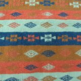 Authentic handmade Tunisian Berber kilim rug in orange wool.