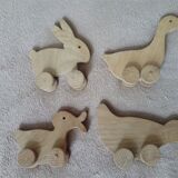 lot de 4 jouets en bois à roulettes
