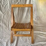 Old varnished wooden folding chair for children