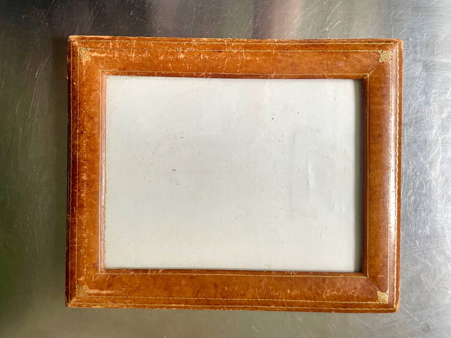 Antique  leather  with gilding frame measurements 31 cm x 25 cm