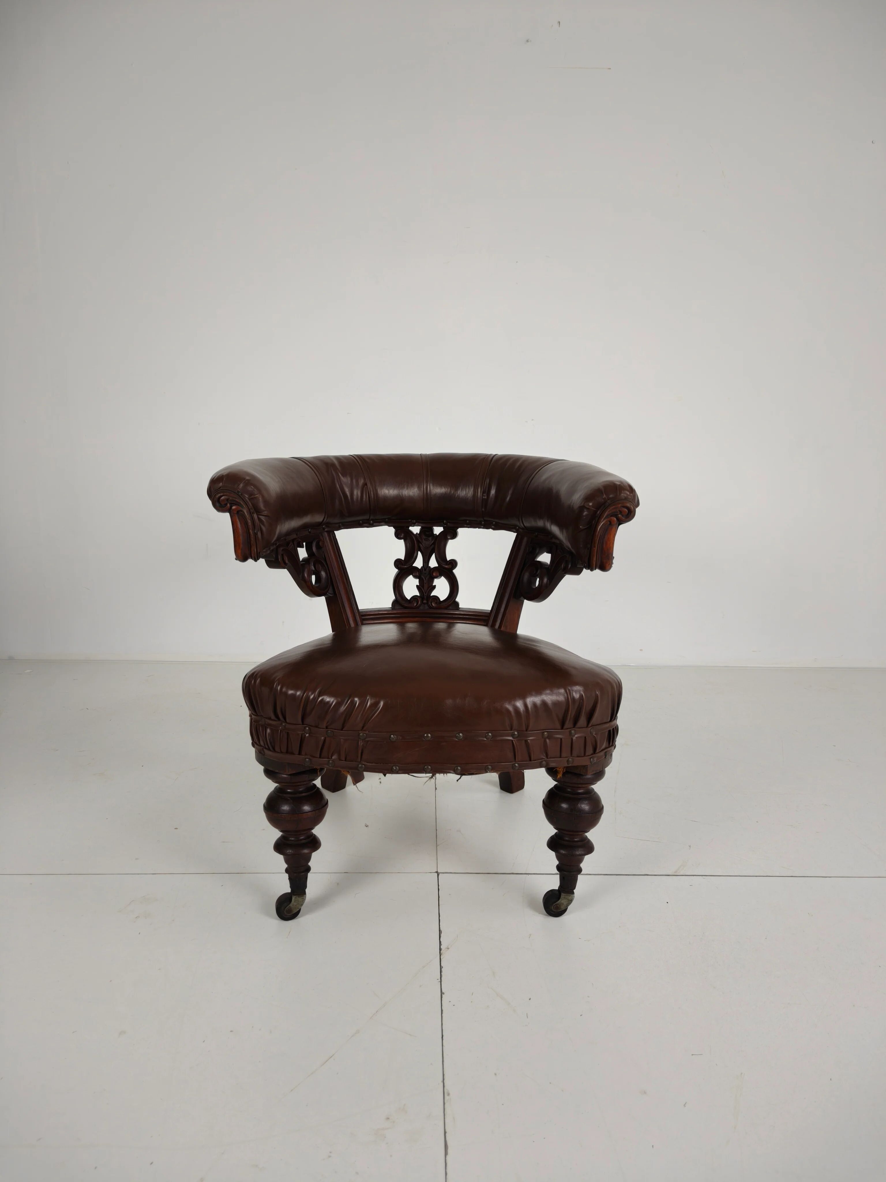 Antique leather armchair by Robson & Son – carved wood & castors, Newcastle