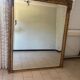 Large mirror from the Napoleonic III era with a floral pediment.