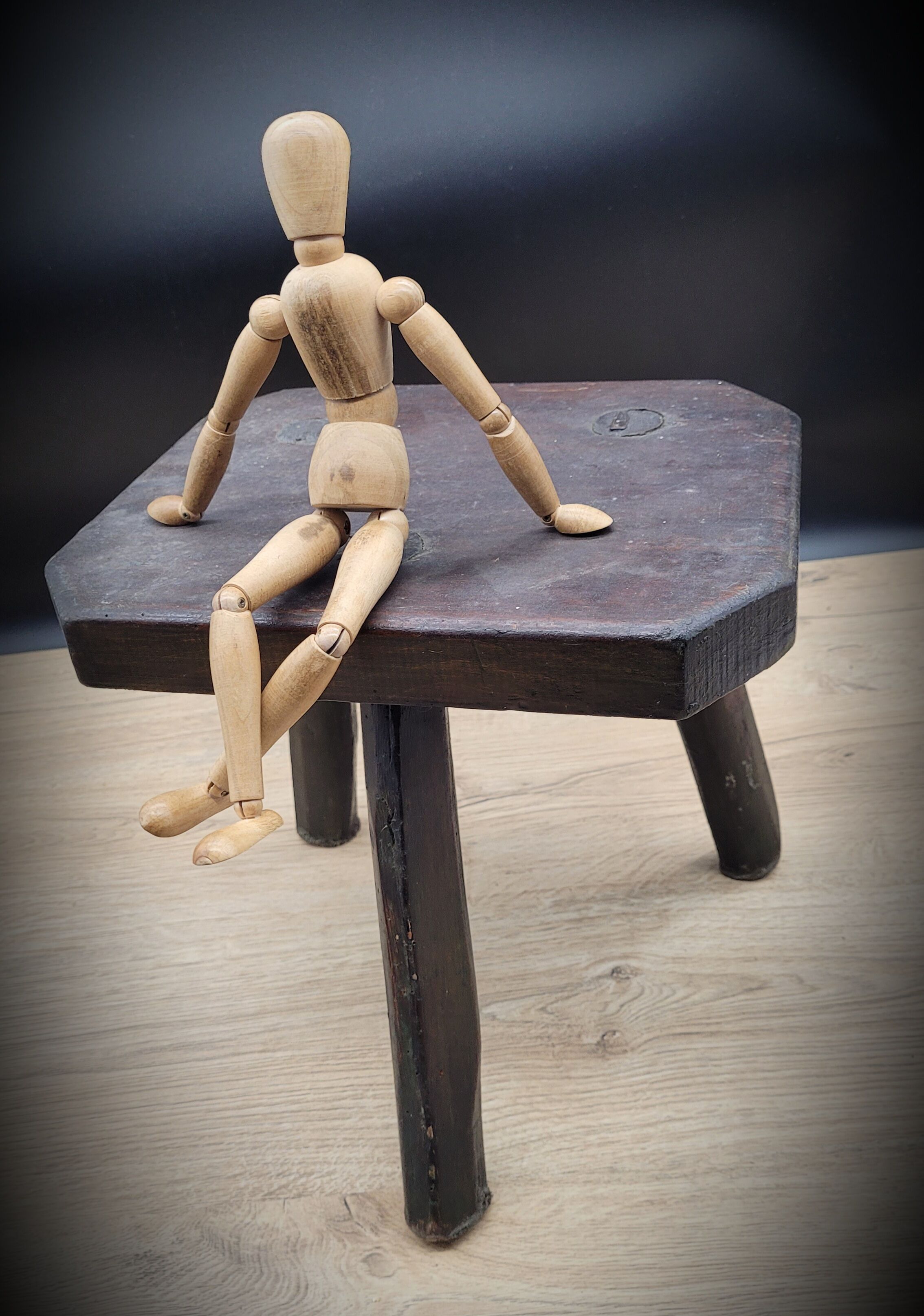 Dark octagon tripod stool