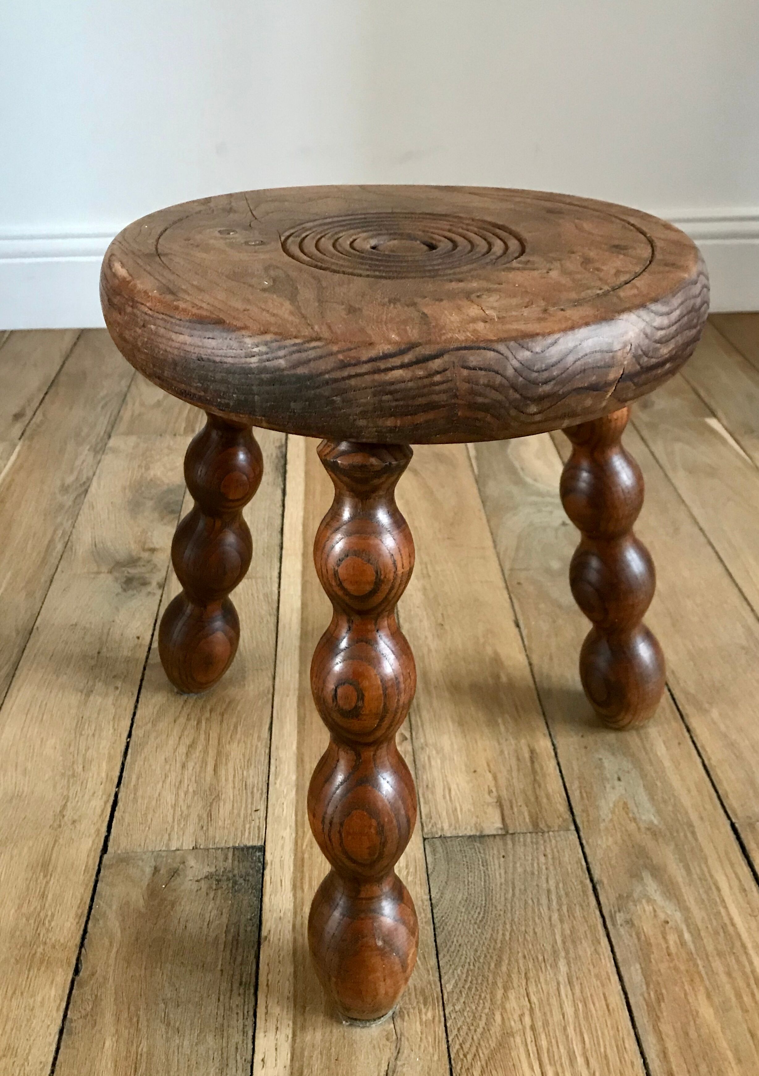 Low wooden stool turned solid 70s