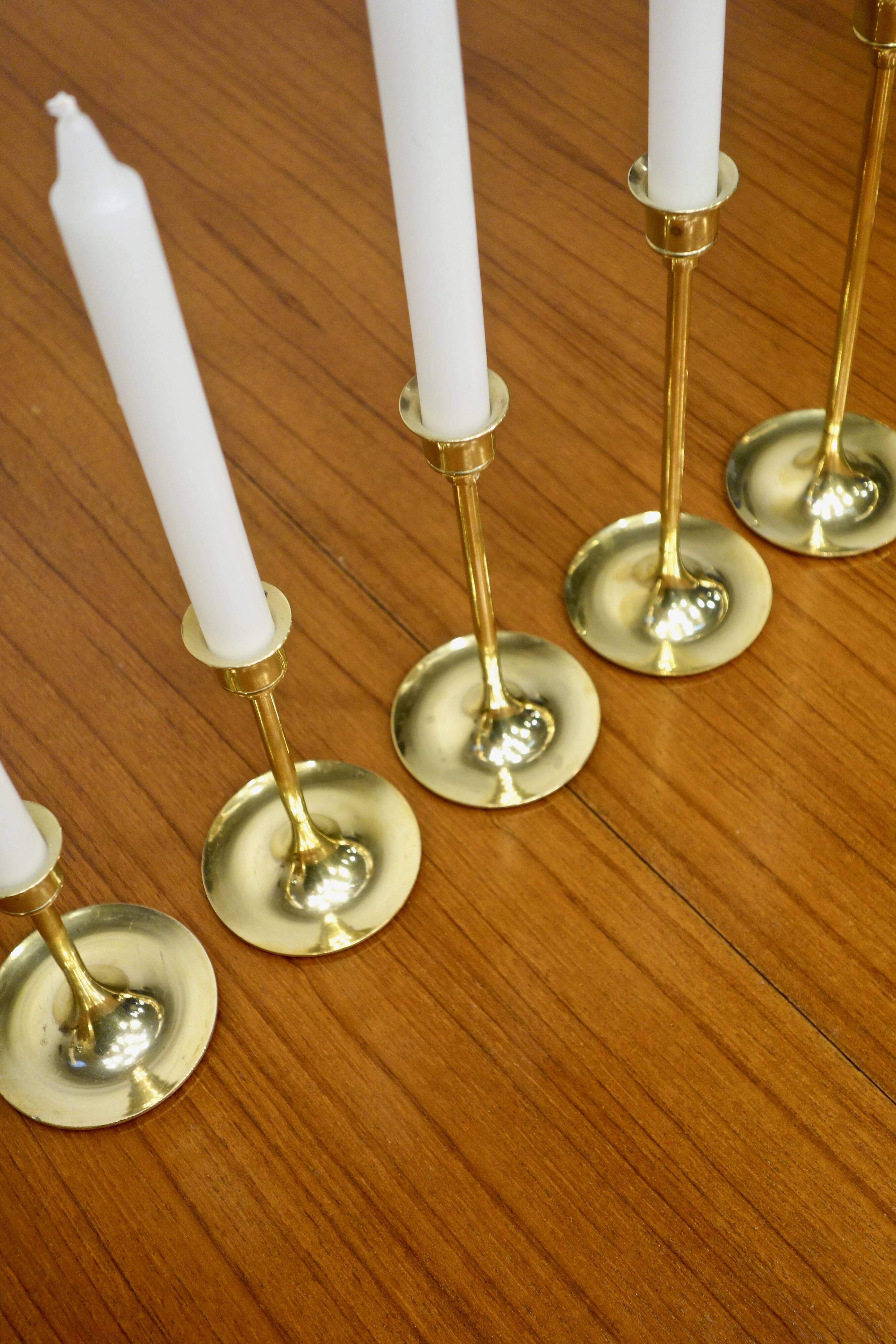 Set of 7 Scandinavian brass candle holders, 1960's