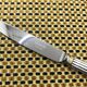 Small silver-plated Christofle knife, Aria model with gold rings