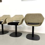 Series of six swivel chairs with an organic shell, patterned fabric and base.