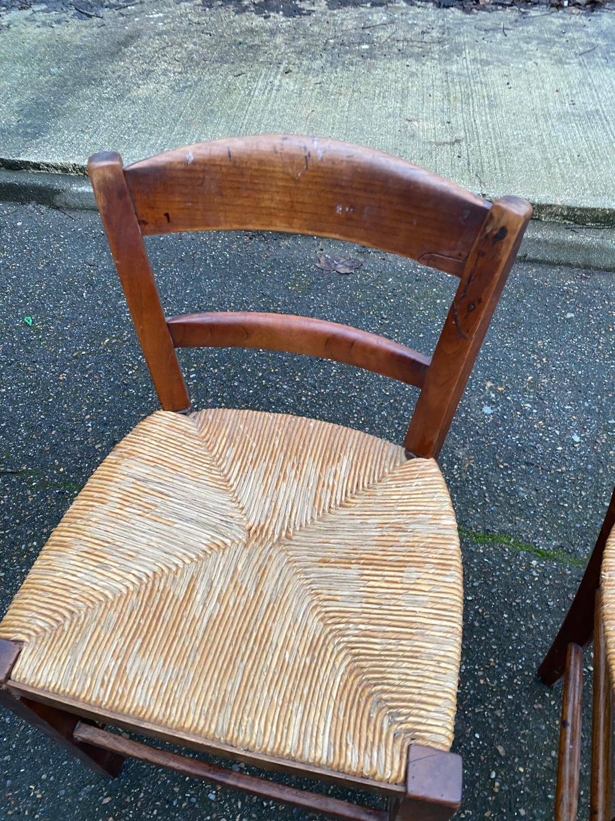 2 solid wood chairs with rush seats, child size.