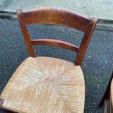 2 solid wood chairs with rush seats, child size.