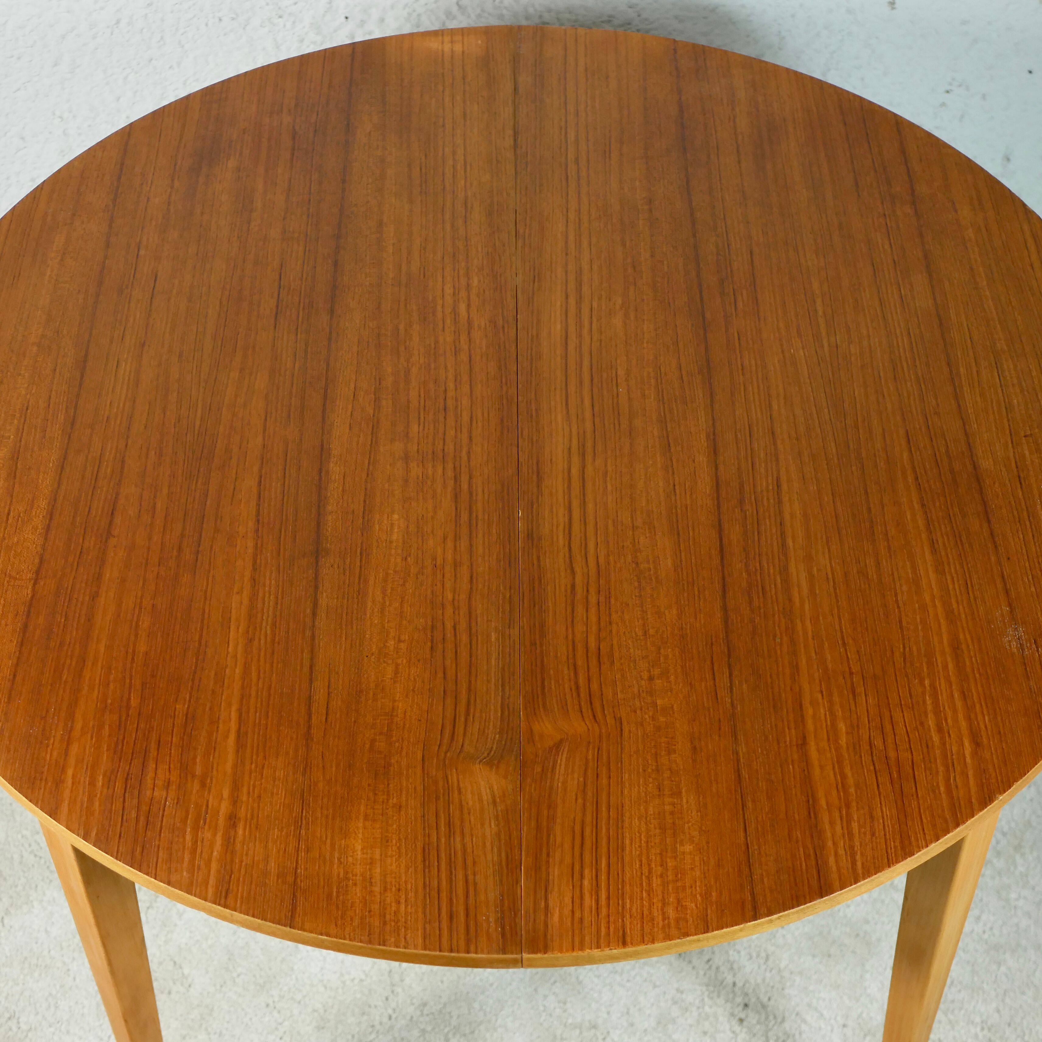 Scandinavian style teak table with butterfly extension