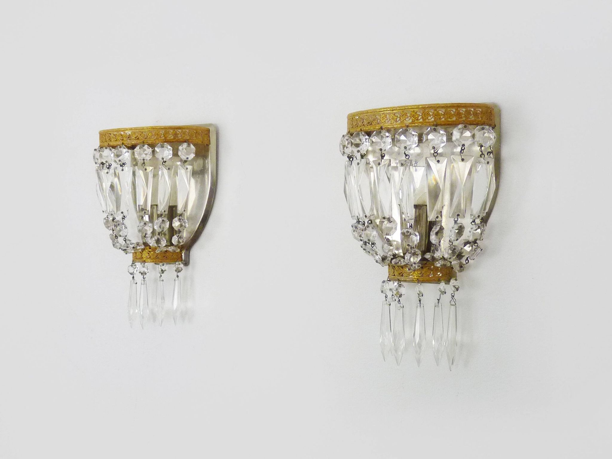 Pair of vintage bronze basket wall lights with glass pendants. The 50's