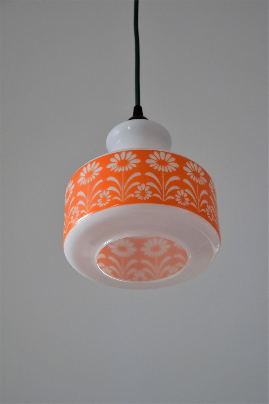 Seventies chandelier in white opaline decorating orange flowers