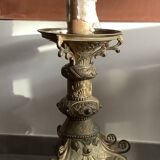 Large bronze candlestick with tripod and winged dog decoration, 19th century.