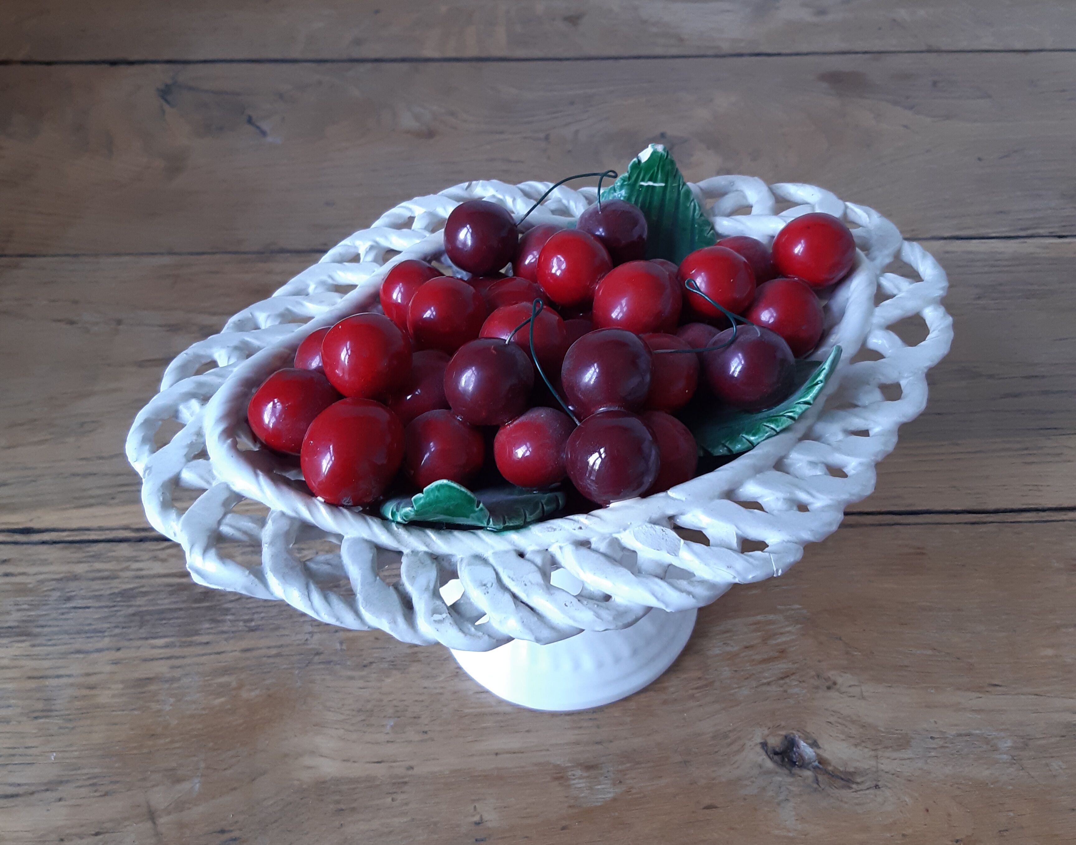Braided basket of porcelain cherries, Bassano vintage 60s