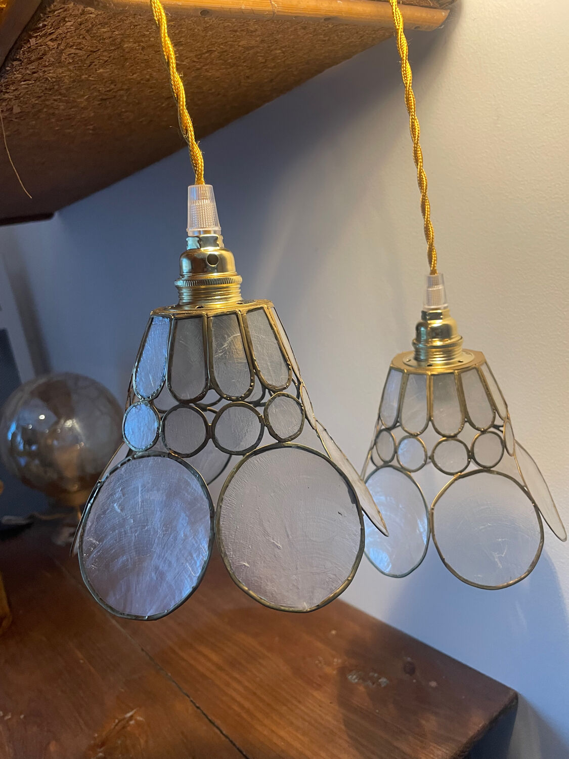 Pair of portable lamps with mother-of-pearl lampshades and brass.