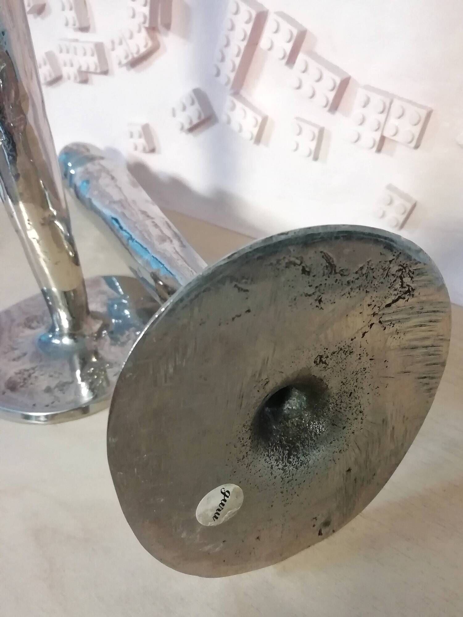 Pair of hammered metal candlesticks