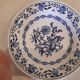 Set of two plates, flat and deep, with a country blue decoration.