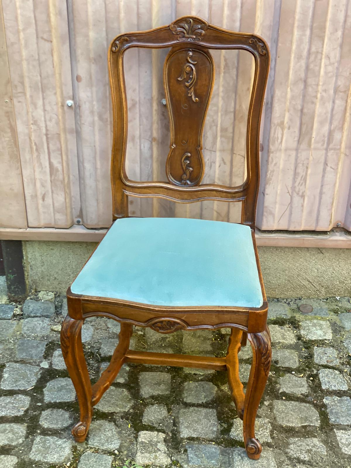 Vintage Louis XV chair made of carved solid wood with blue velvet fabric.
