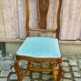 Vintage Louis XV chair made of carved solid wood with blue velvet fabric.
