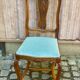 Vintage Louis XV chair made of carved solid wood with blue velvet fabric.