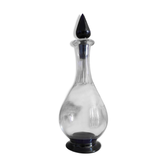 purple and transparent chiseled glass carafe with purple cap
