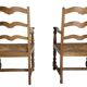 Pair of rustic antique armchairs in wood and woven straw.