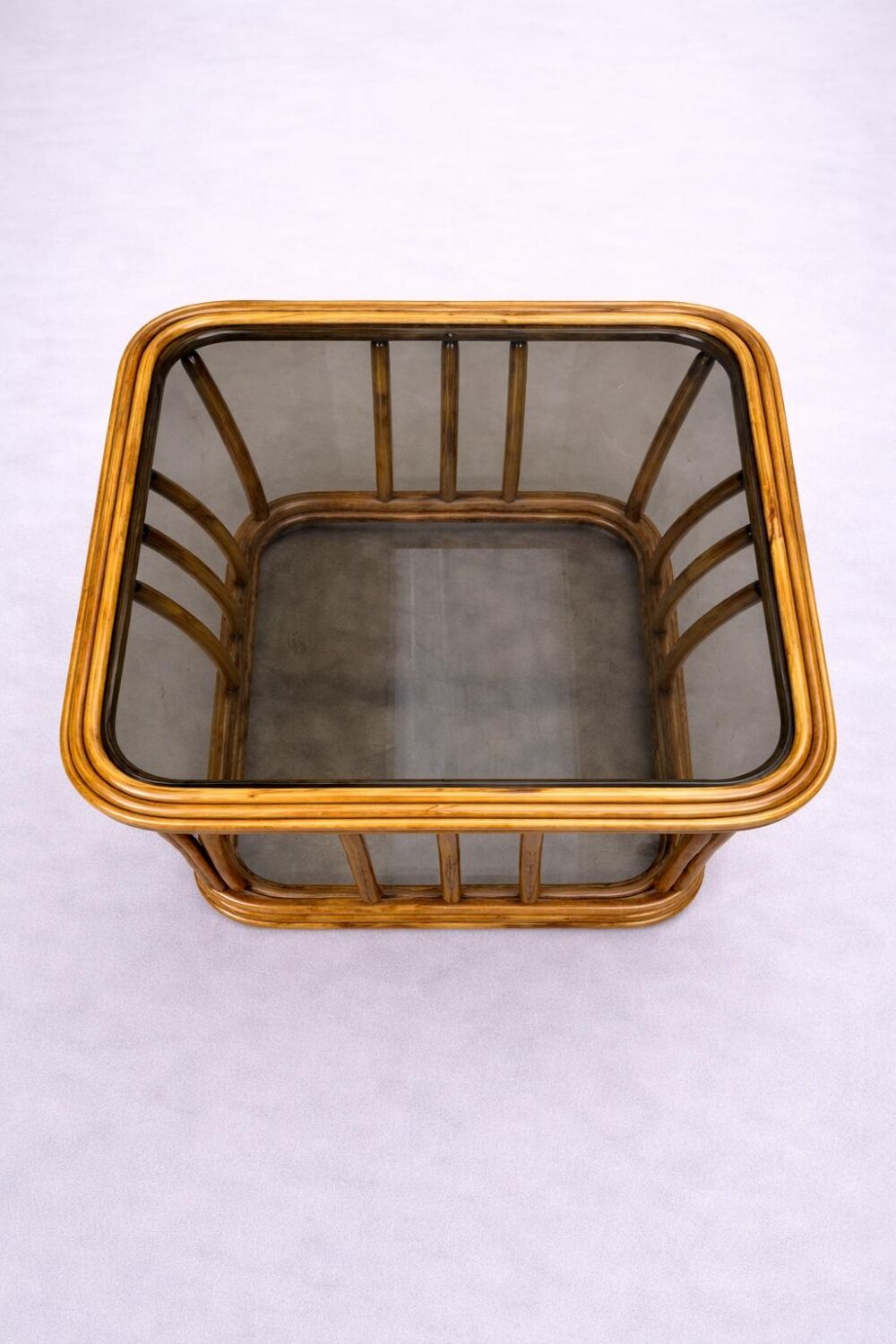 Rattan and smoked glass coffee table, vintage 1970s design.