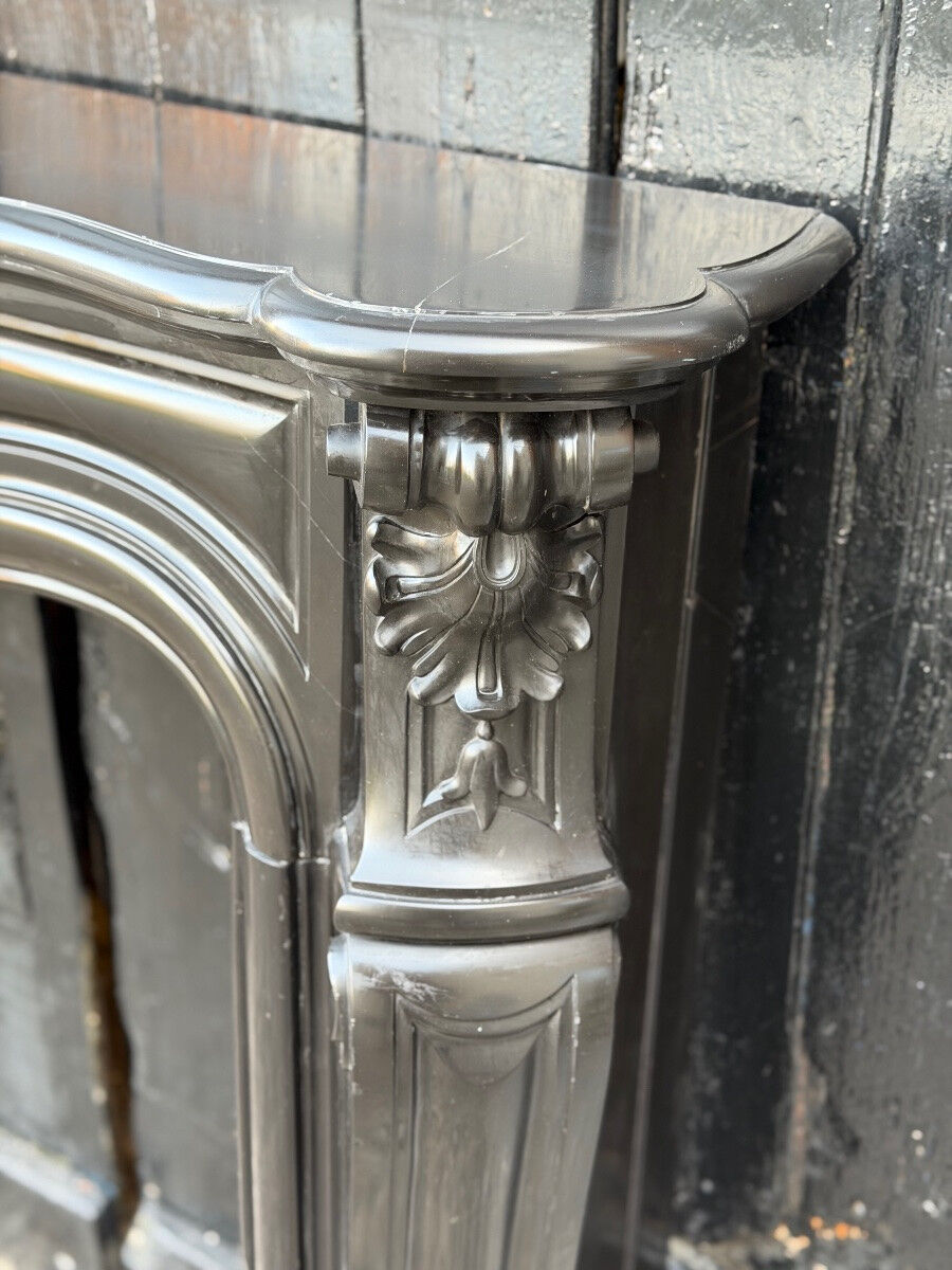 Louis XV style fireplace in black Belgian marble, circa 1880.
