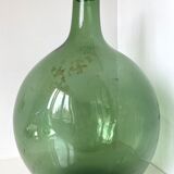 Dame Jeanne ancienne en verre vert à col bagué et ouverture martelée