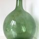 Old demijohn in green glass with ringed neck and hammered opening