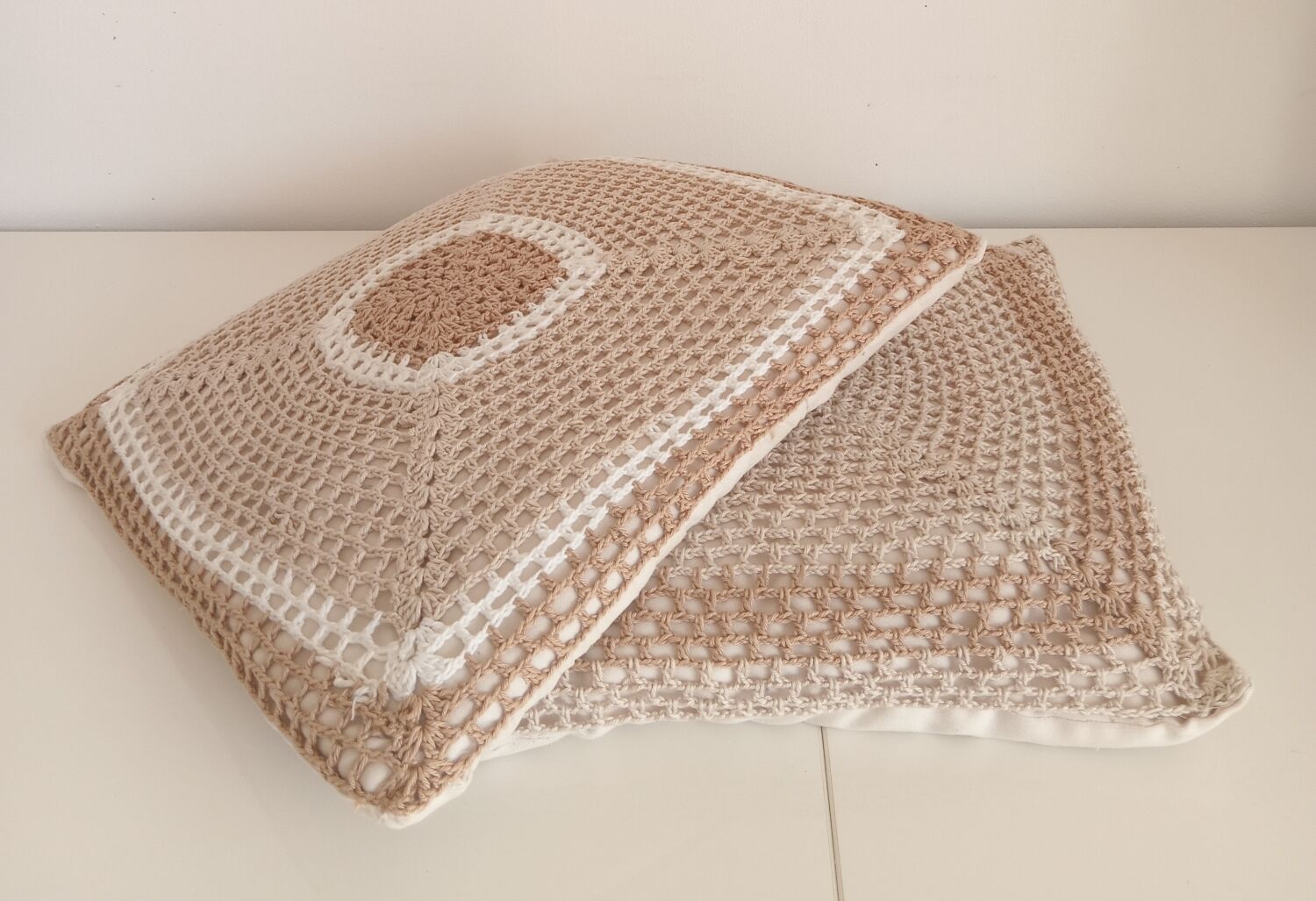 Pair of crocheted cushions