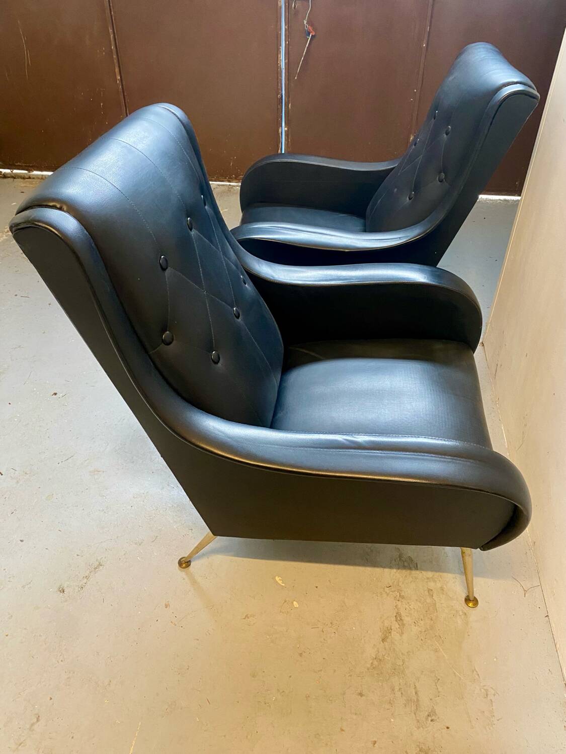 2 vintage faux leather armchairs
