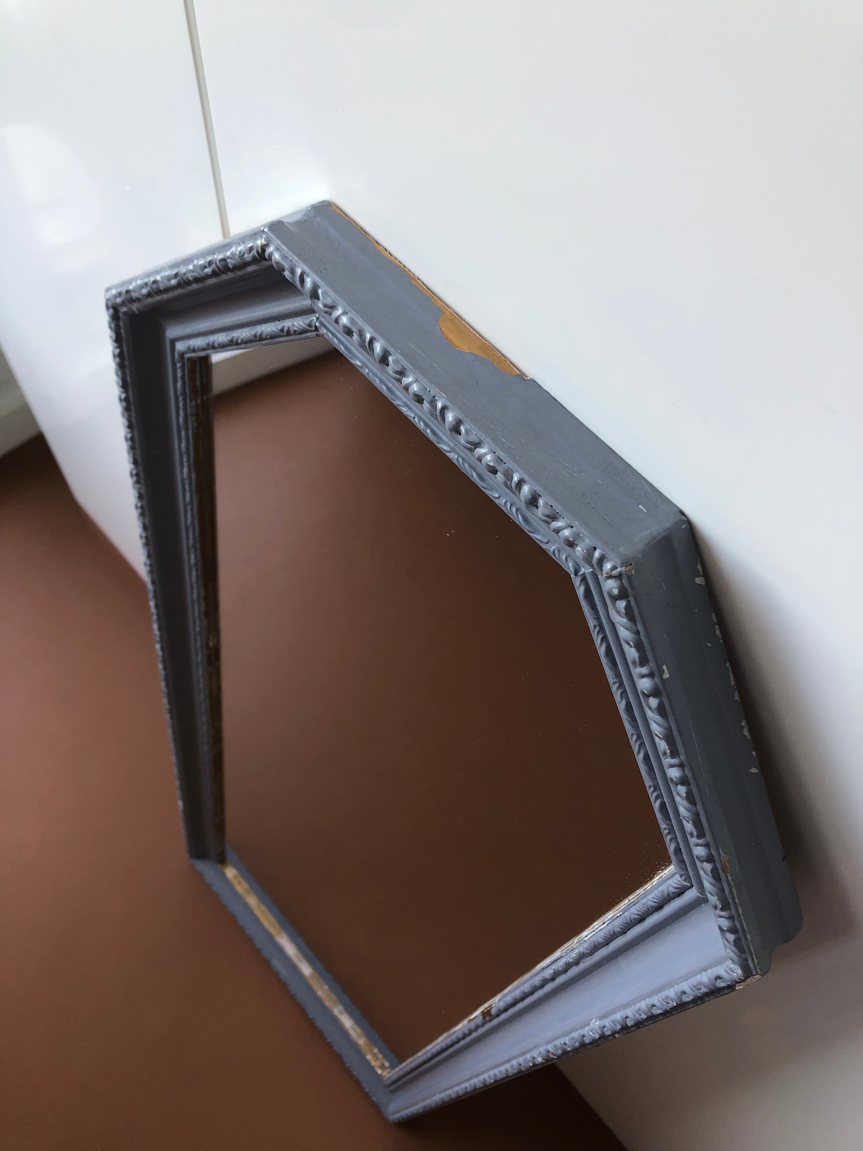 Old patinated mirror golden gray