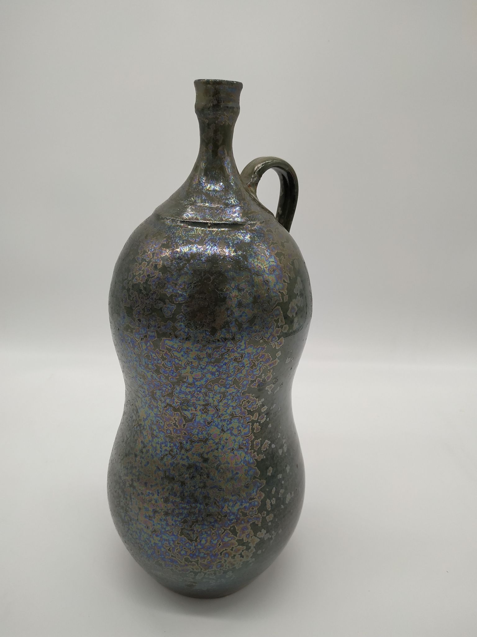 Bottle in iridescent green sandstone from the ceramist jean aimé Poirier