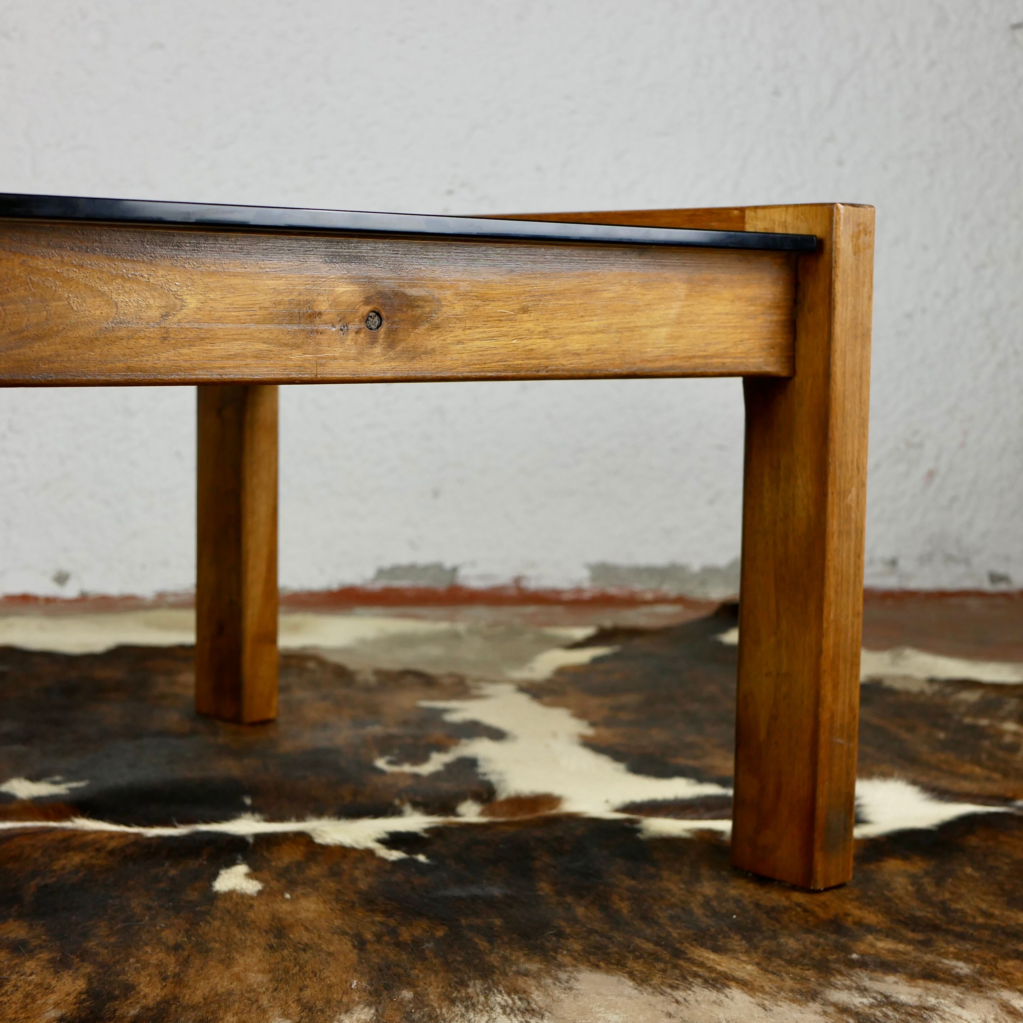 Coffee table in wood and smoked glass